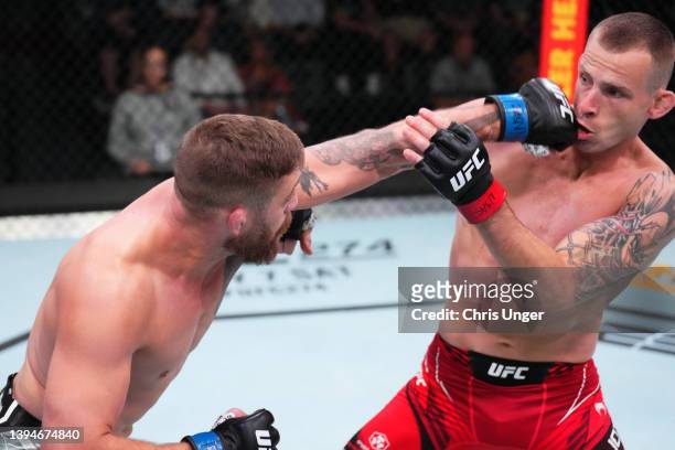 Gerald Meerschaert punches Krzysztof Jotko of Poland in a middleweight fight during the UFC Fight Night event at UFC APEX on April 30, 2022 in Las...