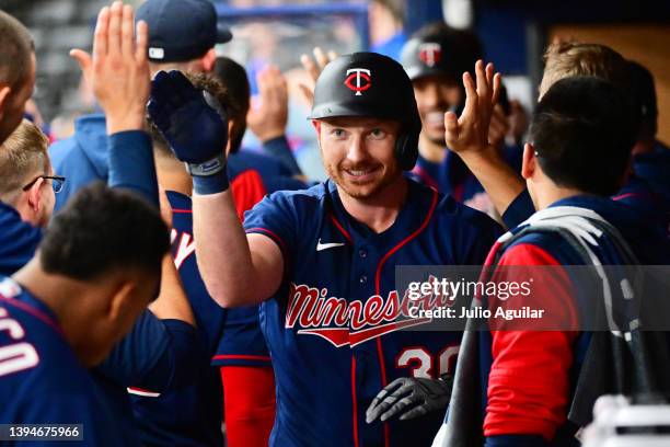 Kyle Garlick of the Minnesota Twins celebrates with teammates after hitting a two run home run in the sixth inning against the Tampa Bay Rays at...