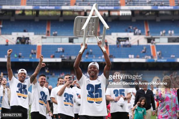 David Alaba of Real Madrid raises a chair as he celebrates following their side's victory in the LaLiga Santander match between Real Madrid CF and...
