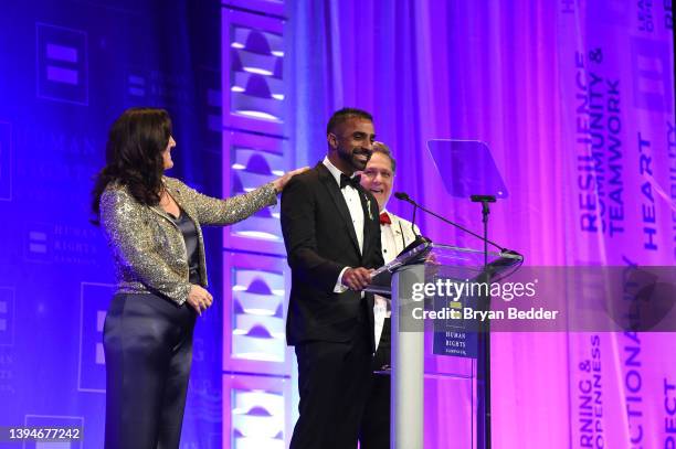 Dolores Covrigaru, Vikrum Vishnubhakta, and Michael Westwood speak onstage during the Human Rights Campaign 2022 Greater New York Dinner at Marriott...