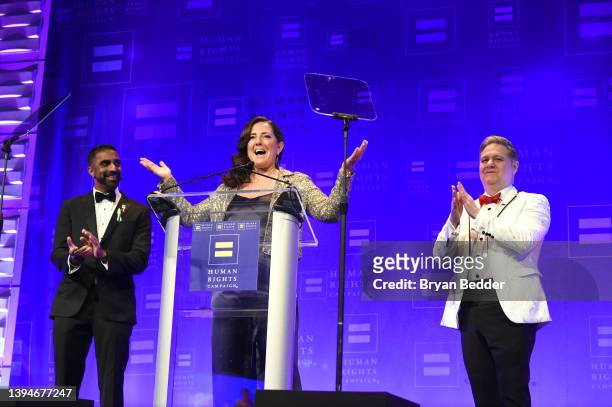 Vikrum Vishnubhakta, Dolores Covrigaru, and Michael Westwood speak onstage during the Human Rights Campaign 2022 Greater New York Dinner at Marriott...