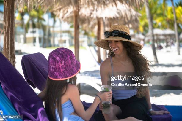 mother and daughter on a beach vacation - cuba girls stock pictures, royalty-free photos & images