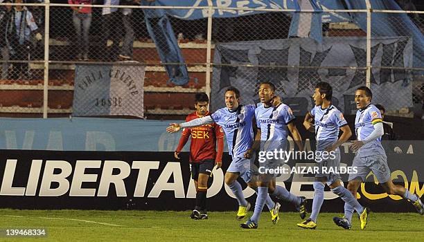 Bolivia's Bolivar footballer Edemir Rodriguez celebrates with teammates after scoring against Chile's Union Espanola, during their Copa Libertadores...