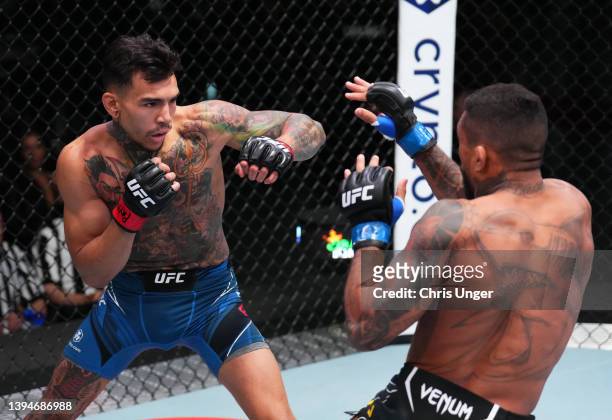 Andre Fili battles Joanderson Brito of Brazil in a featherweight fight during the UFC Fight Night event at UFC APEX on April 30, 2022 in Las Vegas,...