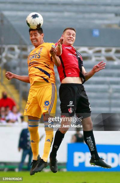 Hugo Ayala of Tigres fights for the ball with Julio Furch of Atlas during the 17th round match between Atlas and Tigres UANL as part of the Torneo...