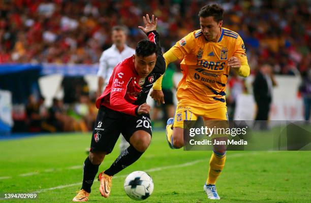 Jairo Torres of Atlas fights for the ball with Sebastian Cordova of Tigres during the 17th round match between Atlas and Tigres UANL as part of the...