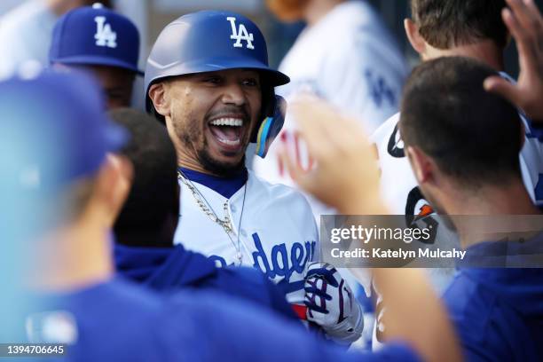 Mookie Betts of the Los Angeles Dodgers celebrates his home run with teammates in the dugout during the first inning against the Detroit Tigers at...