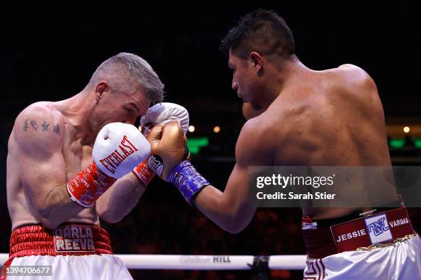 Liam Smith of Great Britain trades punches with Jessie Vargas of the United States for the Super Welterweight Title at Madison Square Garden on April...