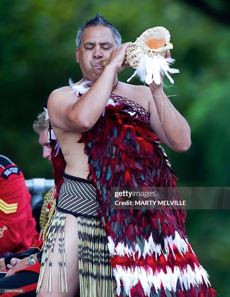 Moari Shell Picture A Maori warrior blows a putatara shell during the remembrance service ...