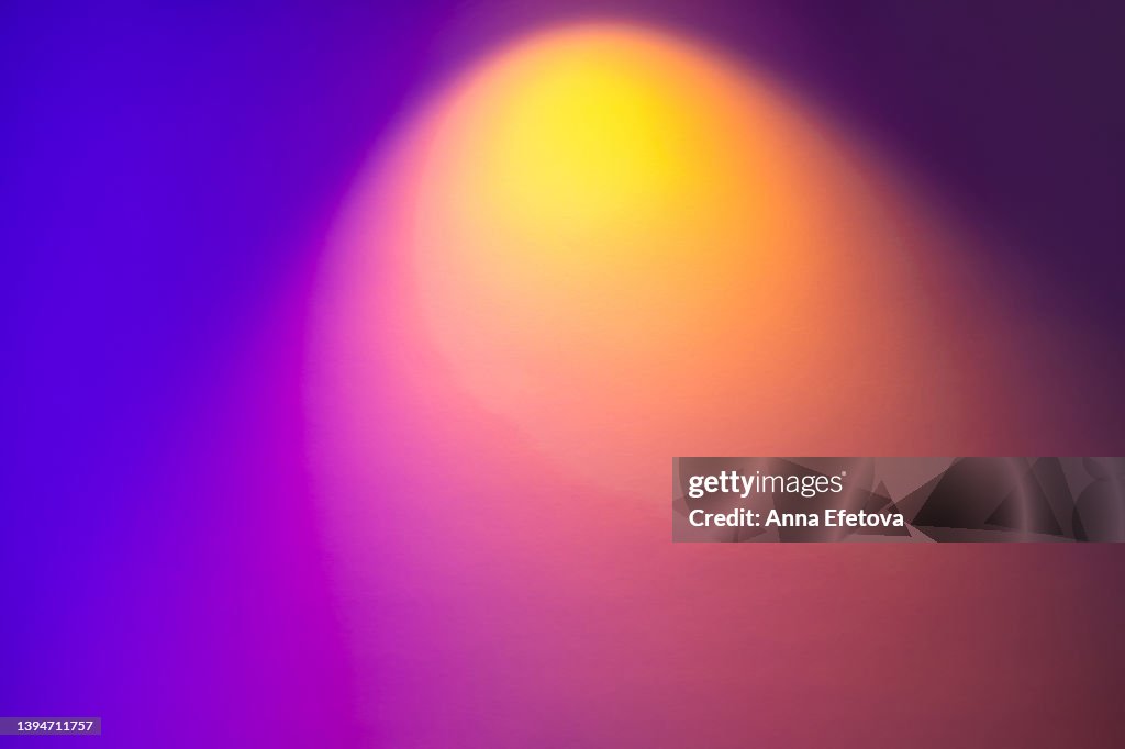 Blurred colorful neon background with abstract shadows and lights pattern. Copy space for your design. Trendy colors of the year.