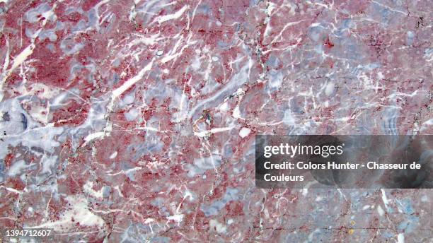 weathered marble surface in pink, blue and white tones in brussels - pink color block stock pictures, royalty-free photos & images