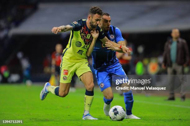 Miguel Layún of America struggles for the ball against Manuel Mayorga of Cruz Azul during the 17th round match between America and Cruz Azul as part...