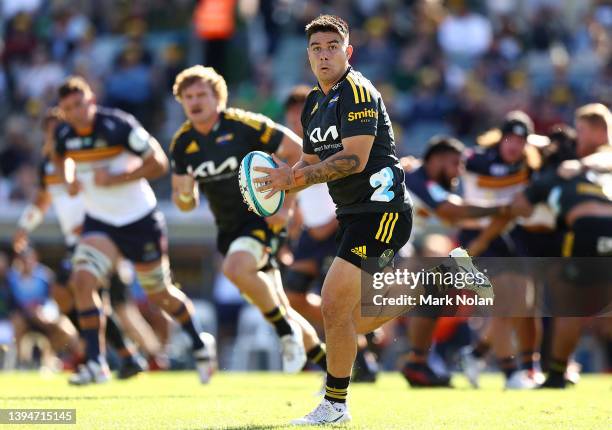 Jackson Garden-Bachop of the Hurricanes passes during the round 11 Super Rugby Pacific match between the ACT Brumbies and the Hurricanes at GIO...