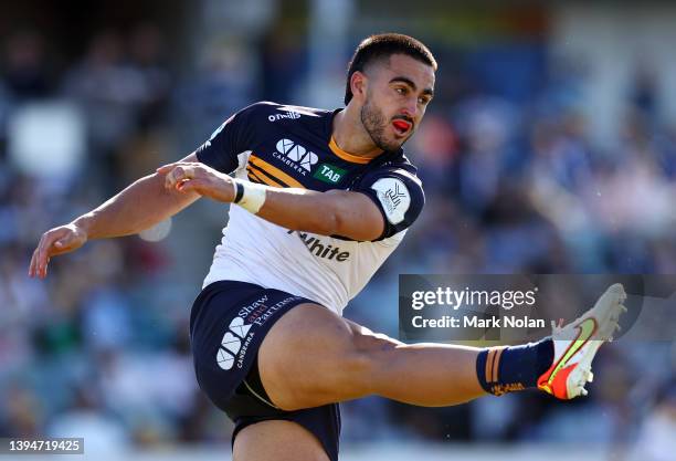 Tom Wright of the Brumbies kicks ahead during the round 11 Super Rugby Pacific match between the ACT Brumbies and the Hurricanes at GIO Stadium on...