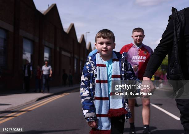 Fans arrive during the Premier League match between Aston Villa and Norwich City at Villa Park on April 30, 2022 in Birmingham, England.