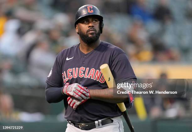 Franmil Reyes of the Cleveland Guardians walks back to the dugout after striking out against the Oakland Athletics in the top of the third inning at...