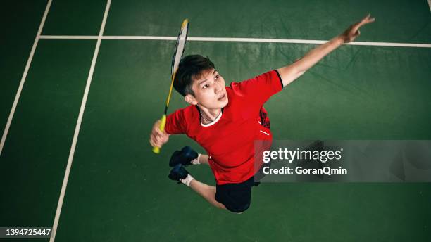 《badminton spirit》jump smash during the match/top view - badminton smash stock pictures, royalty-free photos & images