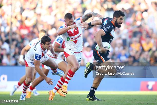 James Tamou of the Tigers makes a break during the round eight NRL match between the St George Illawarra Dragons and the Wests Tigers at WIN Stadium...