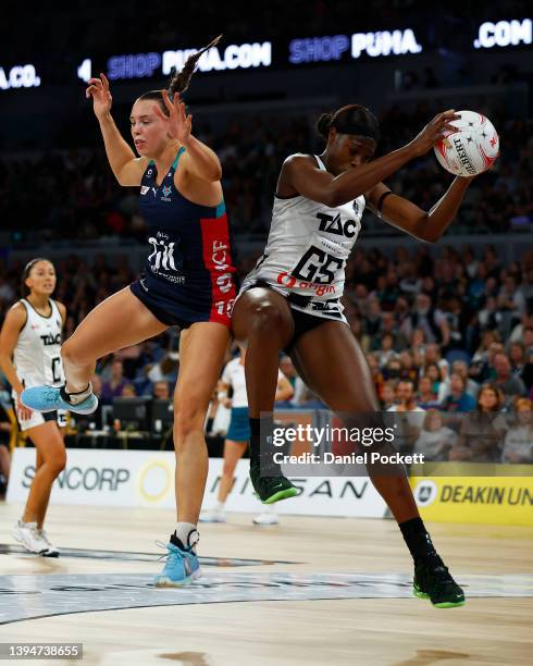 Shimona Nelson of the Magpies and Olivia Lewis of the Vixens contest the ball during the round seven Super Netball match between Melbourne Vixens and...