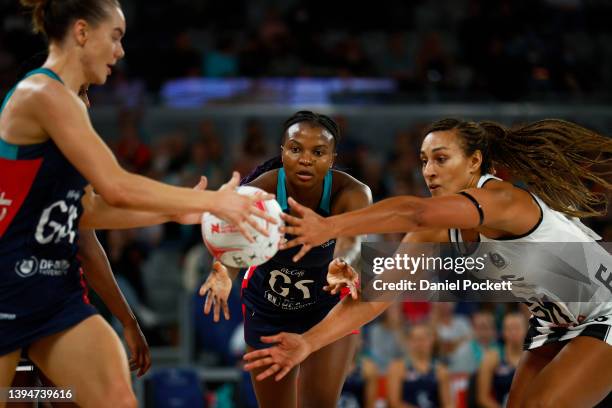 Mwai Kumwenda of the Vixens passes to Kiera Austin of the Vixens under pressure from Geva Mentor of the Magpies during the round seven Super Netball...