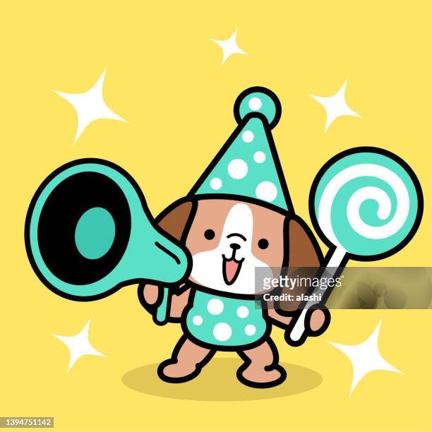 a cute dog wearing a party hat and holding a lollipop is speaking through a megaphone - yap stock illustrations