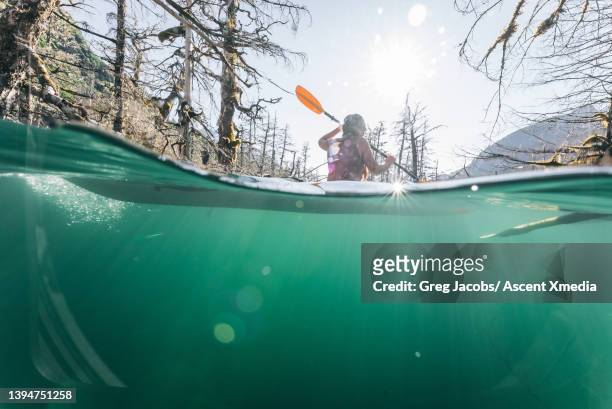 pov of young woman kayaking through lake - pov or personal perspective or immersion stock pictures, royalty-free photos & images