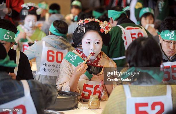 Maiko eats boiled bean curd during the 38th Boiled Bean Curd Eating Contest at Kiyomizu Junsei Okabeya on February 20, 2011 in Kyoto, Japan. The...