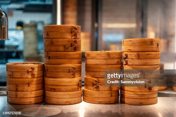 variety of chinese dimsum in bamboo steamers - hong kong food stock-fotos und bilder