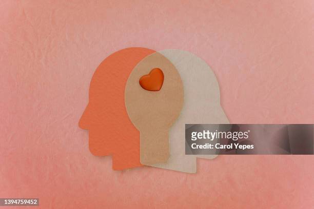 empathy conceptual paper image in pink.love.concept - cabeça humana - fotografias e filmes do acervo