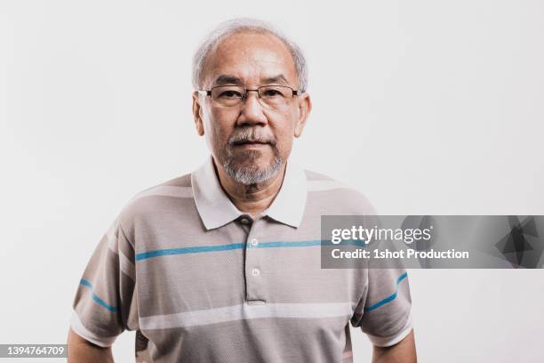 asian senior man portrait, confidence. - grey polo shirt stock pictures, royalty-free photos & images