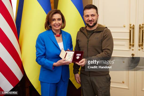 Ukrainian President Volodymyr Zelensky presents the Order of Princess Olga, a Ukrainian civil decoration, to U.S. Speaker of the House Nancy Pelosi...