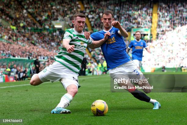 Anthony Ralston of Celtic is challenged by Borna Barisic of Rangers during the Cinch Scottish Premiership match between Celtic and Rangers at Celtic...