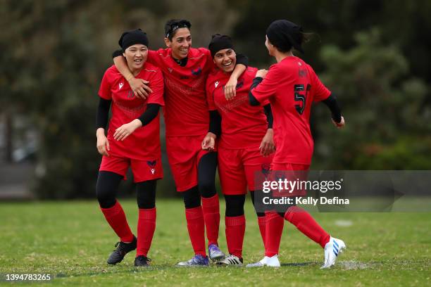 Bahara of the Melbourne Victory Afghan Women's Team celebrates scoring a goal with Shamsia, Manozh and Farida of the Melbourne Victory Afghan Women's...