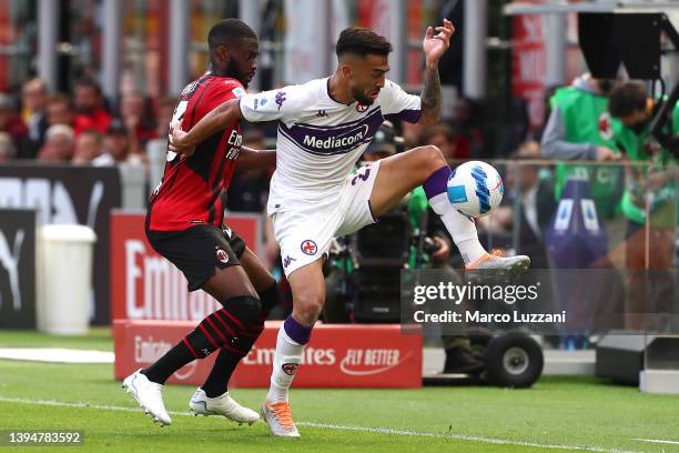 Nicolas Gonzalez of Fiorentina is challenged by Fikayo Tomori of AC Milan during the Serie A match between AC Milan and ACF Fiorentina at Stadio...