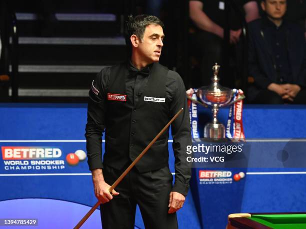 Ronnie O'Sullivan of England reacts during the final match against Judd Trump of England on day 16 of the Betfred World Snooker Championships 2022 at...