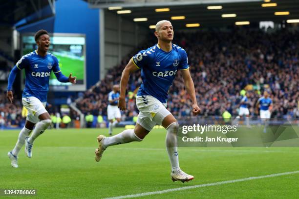 Richarlison of Everton celebrates after scoring their team's first goal during the Premier League match between Everton and Chelsea at Goodison Park...