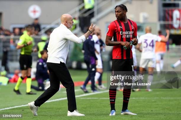 Stefano Pioli speaks to Rafael Leao of AC Milan during the Serie A match between AC Milan and ACF Fiorentina at Stadio Giuseppe Meazza on May 01,...