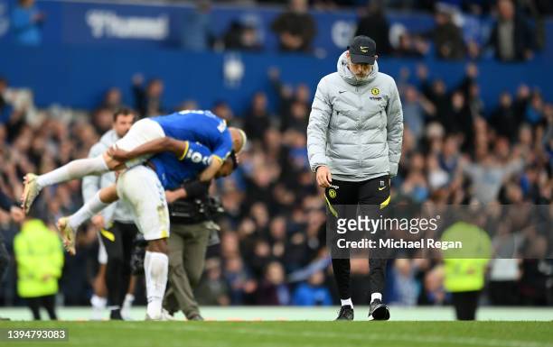 Thomas Tuchel, Manager of Chelsea, reacts after the final whistle as Everton celebrate their side's win after the Premier League match between...