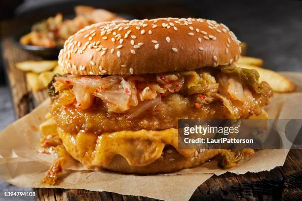 sweet and sour crispy fried chicken burger with kimchi - fried chicken burger stock pictures, royalty-free photos & images