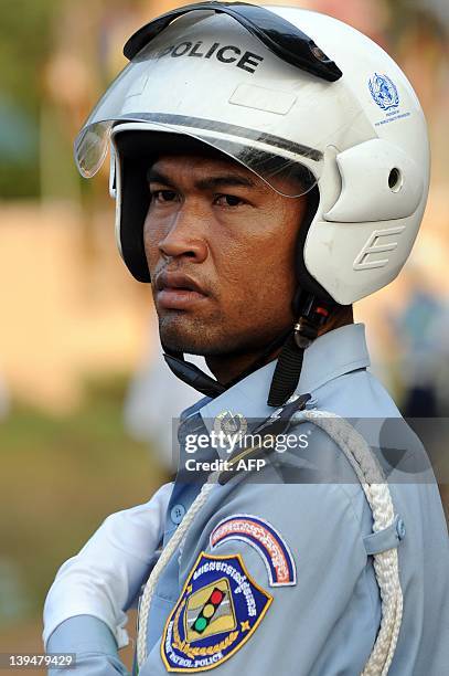 Cambodian traffic police looks on during a ceremony at Oddong mountain in Kandal province, some 40 kilometers north of Phnom Penh on February 7,...