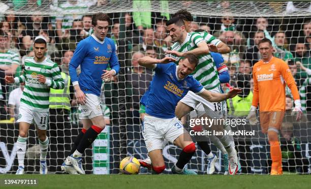 Borna Barisic of Rangers vies with Tom Rogic of Celtic during the Cinch Scottish Premiership match between Celtic and Rangers at Celtic Park on May...