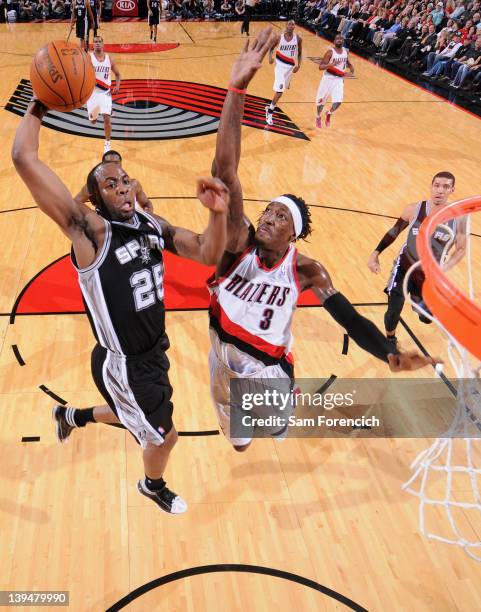 James Anderson of the San Antonio Spurs goes to the basket against Gerald Wallace of the Portland Trail Blazers during the game on February 21, 2012...