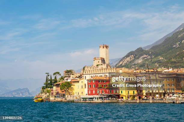 panoramic view of malcesine on lake garda - veneto, italy - garda stock pictures, royalty-free photos & images