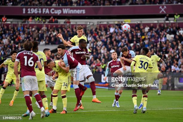 Rob Holding of Arsenal scores their side's first goal during the Premier League match between West Ham United and Arsenal at London Stadium on May...