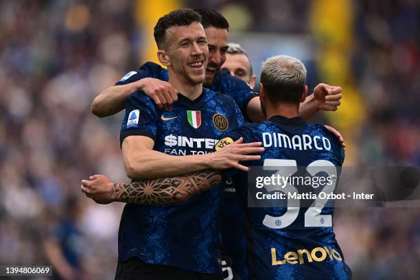 Ivan Perisic of FC Internazionale celebrates with Roberto Gagliardini and Federico Dimarco of FC Internazionale after scoring the opening goal during...