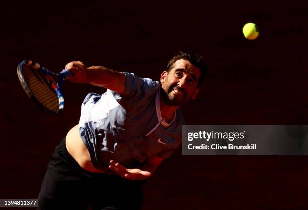 Marc Lopez of Spain serves during his doubles match with partner Carlos Alcaraz of Spain against Lukasz Kubot of Poland and Edouard Roger-Vasselin of...