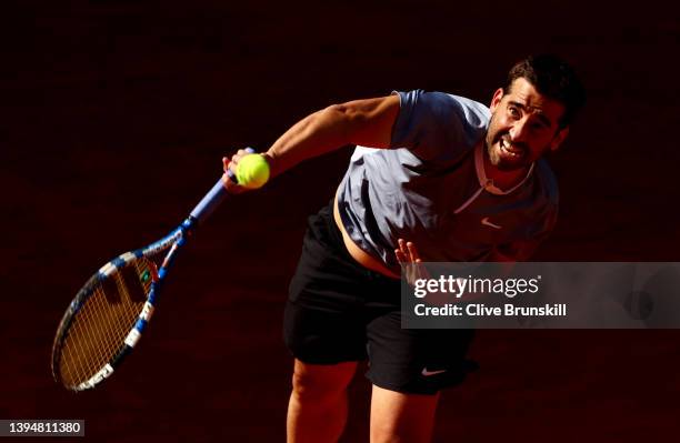 Marc Lopez of Spain serves during his doubles match with partner Carlos Alcaraz of Spain against Lukasz Kubot of Poland and Edouard Roger-Vasselin of...