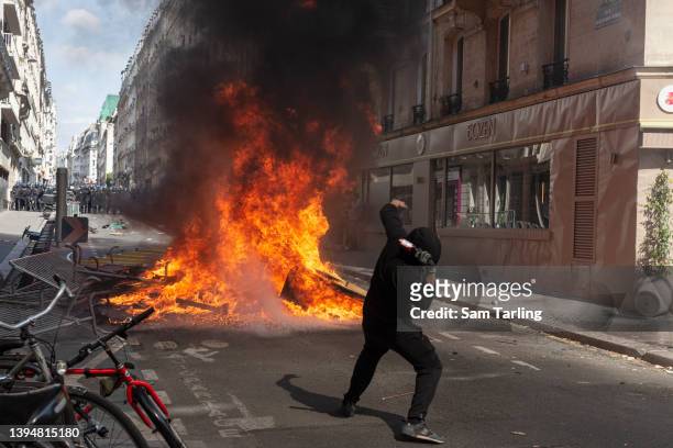 Protesters clash with riot police during May Day demonstrations on May 01 in Paris, France. Numerous businesses were attacked as marchers called for...