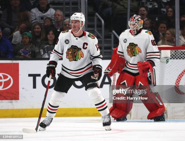 Jonathan Toews of the Chicago Blackhawks and Collin Delia of the Chicago Blackhawks watch play during a 4-1 Los Angeles Kings win at Crypto.com Arena...