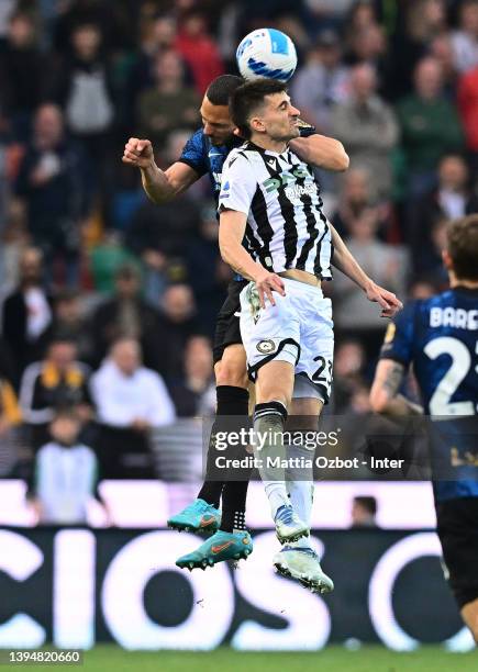 Danilo D'Ambrosio of FC Internazionale competes for the ball with Ignacio Pussetto of Udinese Calcio during the Serie A match between Udinese Calcio...